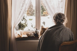 Life Assure Cold Senior Keeping Warm With Blanket And Dog Blog